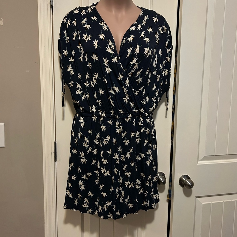 Black white and gold romper shorts with tie sleeves.